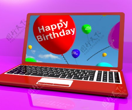 生日快乐的气球在笔记本电脑的屏幕上显示的电子贺卡