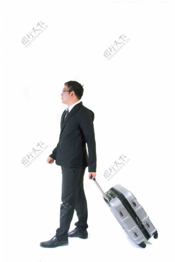 托旅游箱的商务男人图片