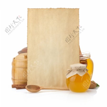 蜂蜜纸张和木勺图片