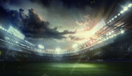 夕阳余晖下的足球场墙纸装饰背景图片